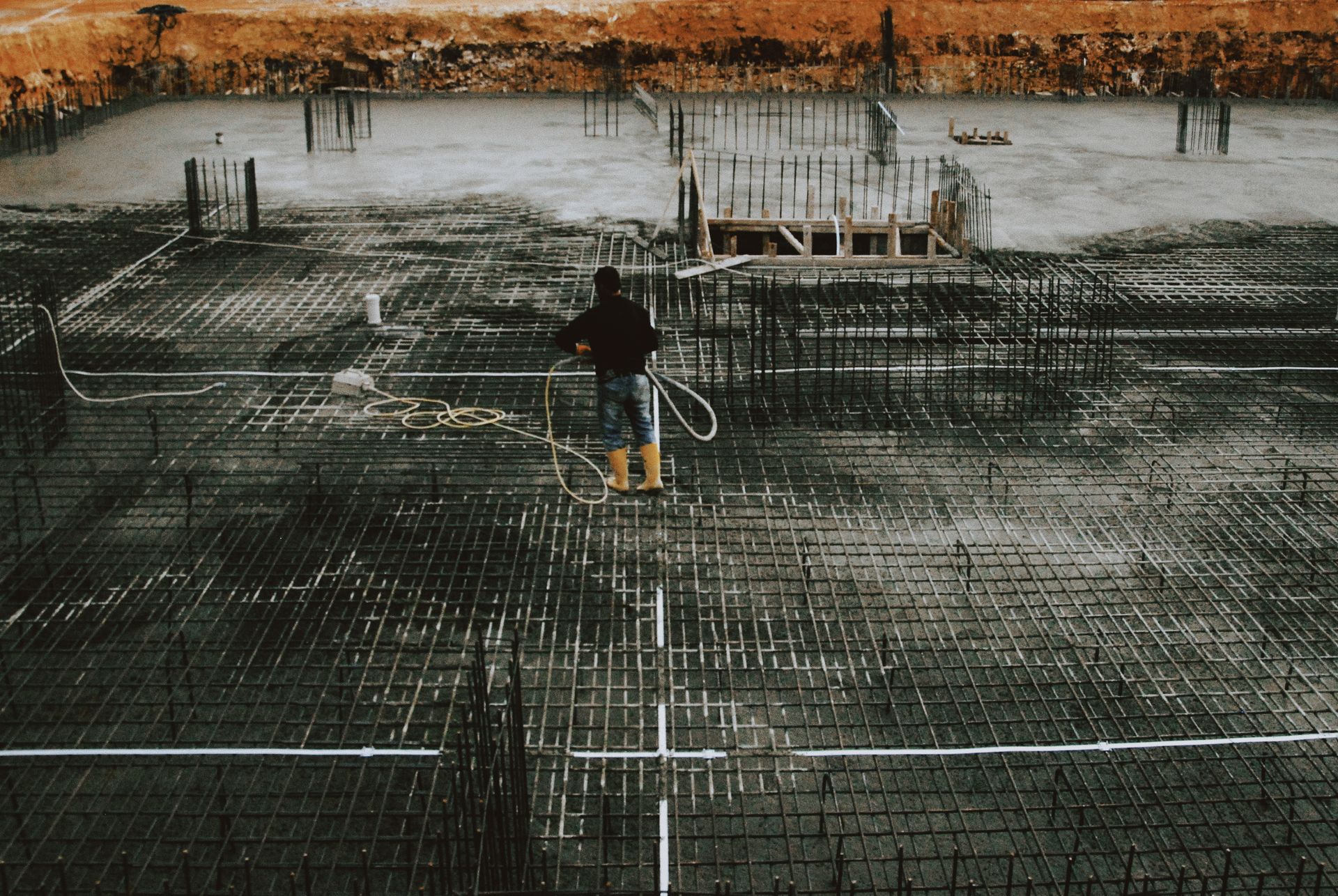 Reinforced raft foundation prepared for casting in an excavated basement